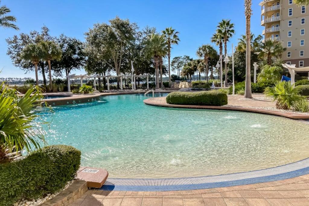 Upper Grand Lagoon House | 3rd-floor beach & pool-view condo with outdoor pool hot tub grills balcony