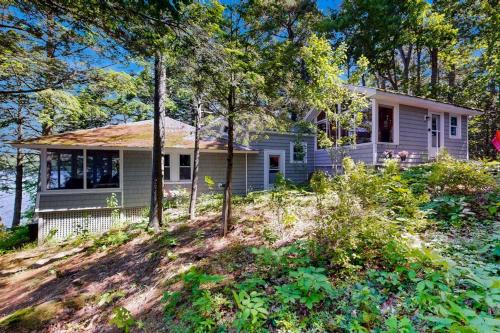 Bremen House | Lakefront cottage with dock, screened porch, & Island in Biscay Pond