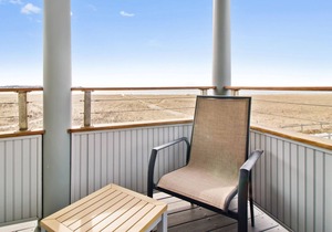 Lighthouse Suites are located directly on the white sands of Pine Point Beach.