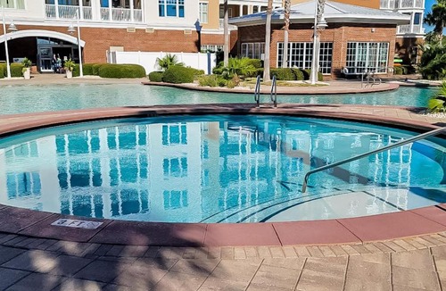 Upper Grand Lagoon House | 3rd-floor beach & pool-view condo with outdoor pool hot tub grills balcony