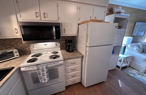 Gulf Stream Estates Condo | Beach Haven Ground Floor Walk to Beach Pool + Fishing Dock Gated