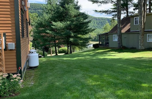 Wells House | Beautiful Lake-side home in Wells, VT Lake view, private dock, screened-in porch