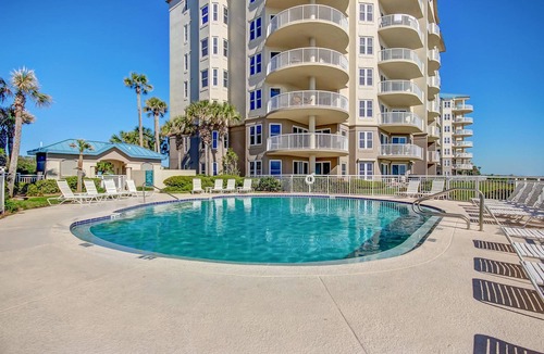 Amelia City Condo | Elegant, oceanfront condo with balcony, washer/dryer & on-site pool