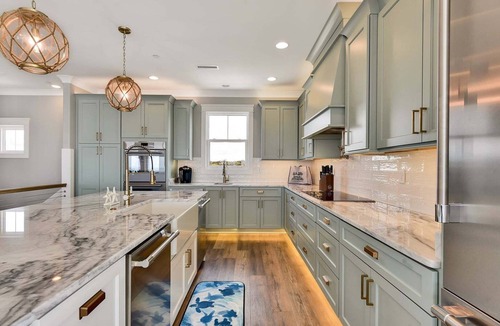 Yaupon Beach House | Experience luxury at Saltwater Gospel, a stunning 13-bedroom oceanfront retreat in Oak Island!