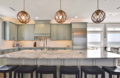 Yaupon Beach House | Experience luxury at Saltwater Gospel, a stunning 13-bedroom oceanfront retreat in Oak Island!