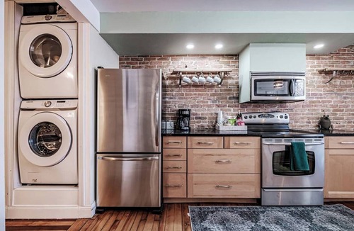 Parkside Apartment | Experience Portland’s charm in this beautifully restored 2-bed, 1.5-bath Victorian apartment! Located downtown, enjoy modern comforts, historic elegance, a private backyard, AC, and 1 free parking spot. Perfect for your Maine getaway! 🦞