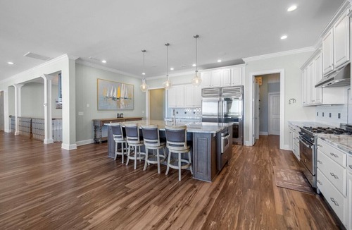 North Topsail Beach House | Experience oceanfront luxury at Topsail Manor, a spacious 8-bedroom paradise in North Topsail Beach.