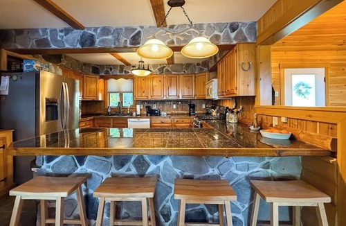 Rome House | Inviting Lakeside Home with direct dock access, patio seating, and gas fireplace