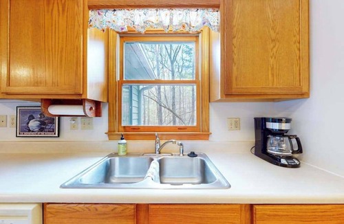 Winfield Cove House | Mountainside abode with a wood stove, firepit, grill, sunroom, AC, and W/D