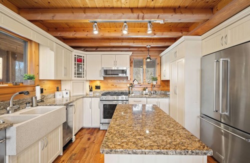 Island Falls House | Pleasant View Luxury Off-Grid Estate with Hot Tub, Gym & Direct ATV Access