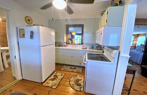 New Braunfels House | Water Front Rustic Cottage- Private-Guest Haus with Hot Tub sleeps 6.