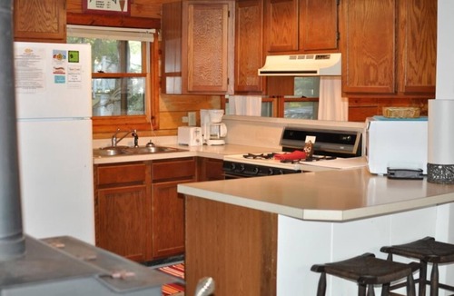 Tranquil Harbour House | Wateroak shaded home with screened porch one direct block from beach