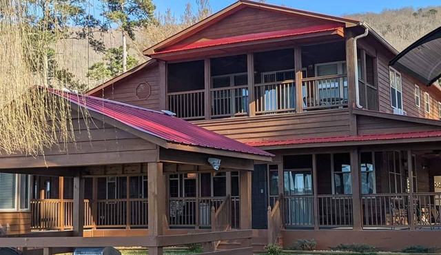 Beautiful rustic lodge located on Lake Guntersville with private boat ramp/dock.