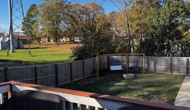 Cute home with fenced backyard, firepit & swings. Near downtown. Pet-friendly!