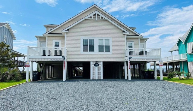 Experience oceanfront luxury at FINS, a spacious 10-bedroom retreat in Holden Beach.