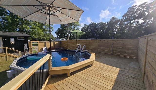 Large Summer Getaway near the beach with private pool, Hottub, and firepit, three miles to Beach.