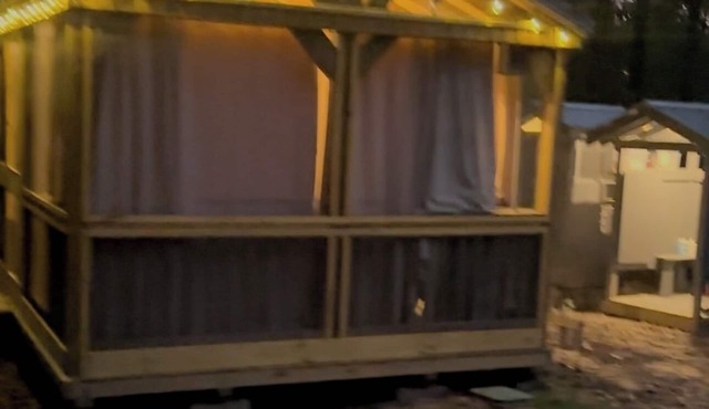Mentone glamping getaway in a private screened in cabin in charming Mentone