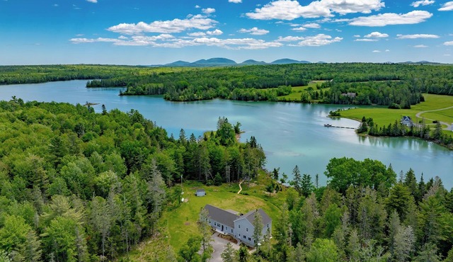 Oceanfront, mobility-minded home: dock, kayaks, views, hot tub, fire pit + games