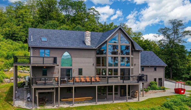 Sprawling mountain-view home with private pool, hot tub, game room, & fireplace