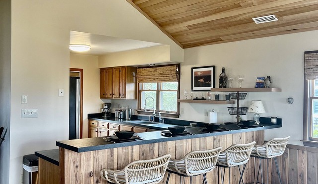 Three-bedroom house with views, decks, golf cart and home gym!