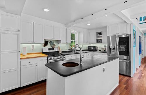 Harrison House | Charming Lakeside Village Farmhouse Retreat